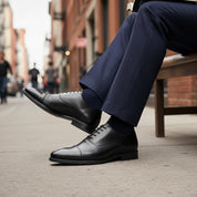 model-siting - Men's Black Leather Cap-Toe Dress Shoes