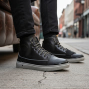 model-siting - Men's Black Leather High-Top Sneakers