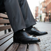 model-siting - Men's Black Leather Wing Tip Brogue Dress Shoes