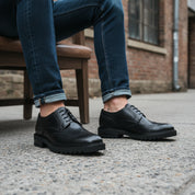 model-siting - Men's Black Leather Wingtip Brogue Shoes