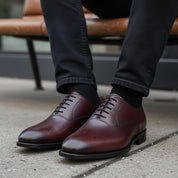 model-siting - Men's Burgundy Whole Cut Oxford Leather Dress Shoes