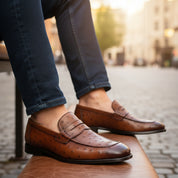 Men's Ostrich Print Leather Moccasins in Brown - model-siting