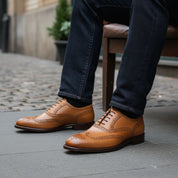 model-siting - Men's Tan Leather Wingtip Dress Shoes