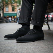 Men's Black Suede Wingtip Dress Shoes - model-sitting-bench