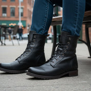 Men's Handmade Black Leather Combat Boots with Lace-Up Design - model-sitting-bench