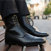 Men's Handmade Black Leather Ankle Boots with Premium Craftsmanship - model-sitting-bench