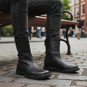 Men's Black Leather Back Zip Boots - model-sitting-bench