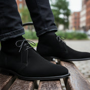 Men's Handmade Black Suede Chukka Boots with Luxurious Craftsmanship - model-sitting-bench