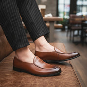 Men's Brown Leather Loafers - model-sitting-bench