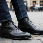 Men's Black Leather Brogue Dress Boots - model-sitting-bench