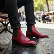 Men's Red Leather Chelsea Boots - model-sitting-bench