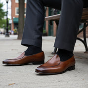Men's Brown Leather Penny Loafers - model-sitting-bench