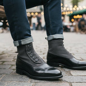 Men's Black & Gray Leather Ankle Boots - model-sitting-bench
