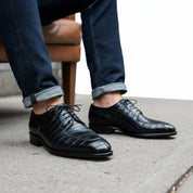Men's Black Alligator Embossed Leather Dress Shoes - model-sitting-bench