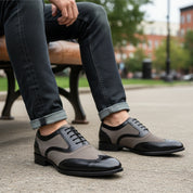 Men's Black and Gray Wingtip Brogue Tuxedo Dress Shoes - model-sitting-bench