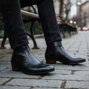 Men's Black Ankle Leather Boots with Side Zipper - model-sitting-bench