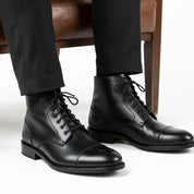 model-sitting-bench - Men's Black Leather Cap Toe Ankle Boots