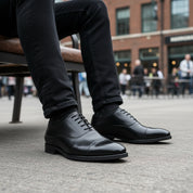 model-sitting-bench - Men's Black Leather Cap-Toe Dress Shoes