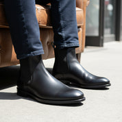 model-sitting-bench - Men's Black Leather Chelsea Boots