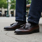 model-sitting-bench - Men's Black Leather Fringe Moccasins