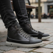 model-sitting-bench - Men's Black Leather High-Top Sneakers