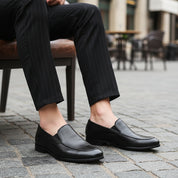 model-sitting-bench - Men's Black Leather Moccasin Loafers