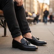 Men's Black Leather Moccasins with Tassels - model-sitting-bench