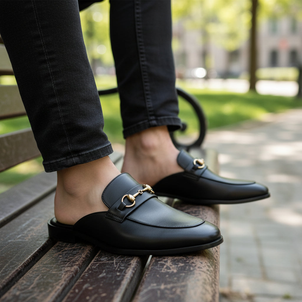Men's Black Leather Mule Slippers with Flat Horsebit - model-sitting-bench