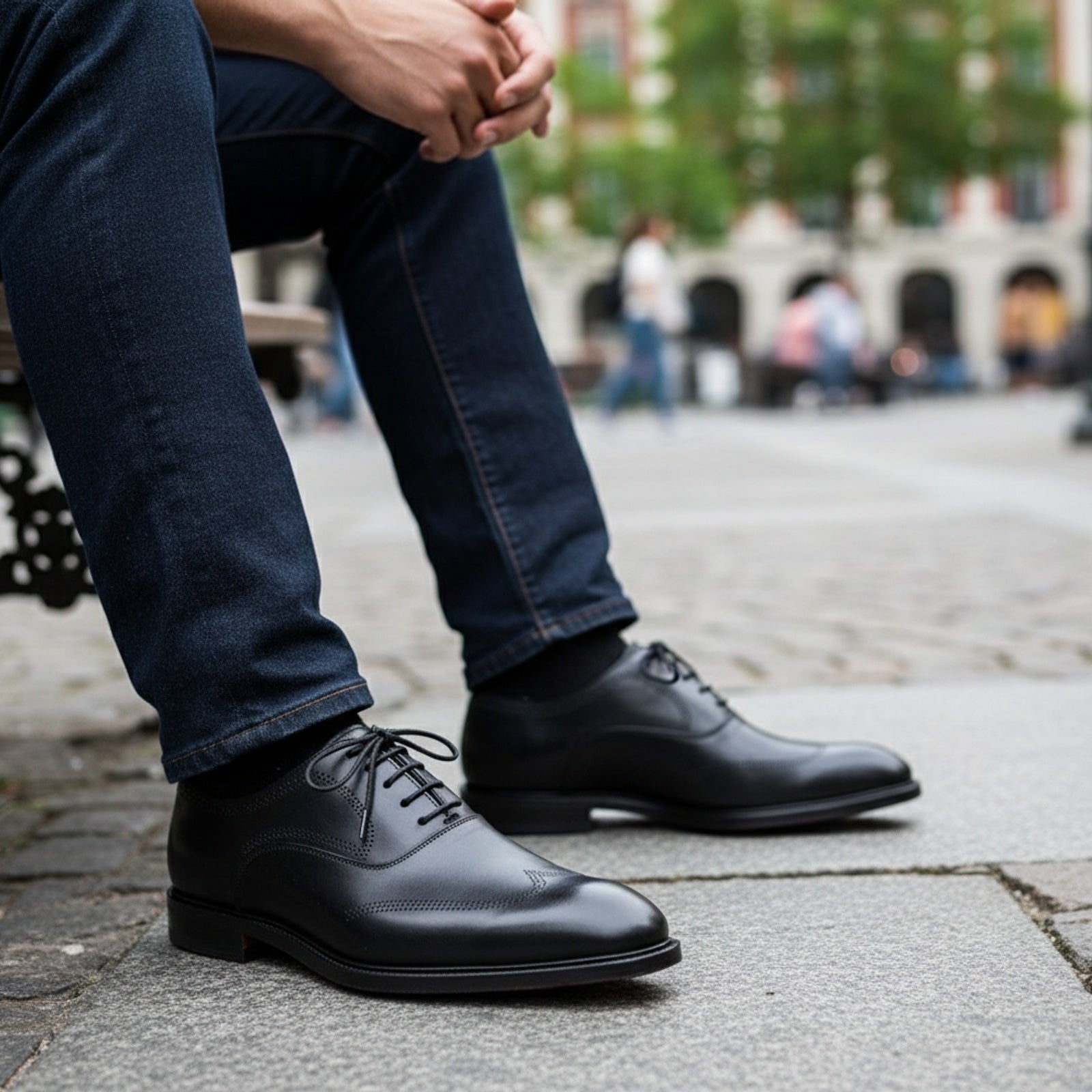 Men's Black Leather Wingtip Oxford Dress Shoes - model-sitting-bench