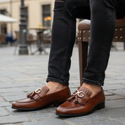 model-sitting-bench - Men's Brown Leather Fringe Moccasins