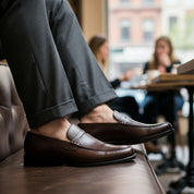 Men's Brown Leather Moccasins - model-sitting-bench