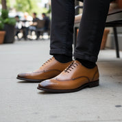 model-sitting-bench - Men's Brown Leather Wingtip Brogue Shoes