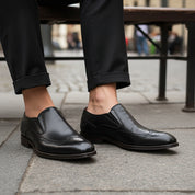 model-sitting-bench - Men's Brown Leather Wingtip Loafers