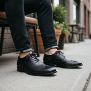 model-sitting-bench - Men's Brown Leather Wingtip Oxford Shoes