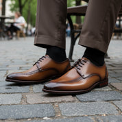 model-sitting-bench - Men's Cap-toe Leather Oxfords in Brown