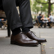 model-sitting-bench - Men's Dark Brown Leather Oxford Dress Shoes