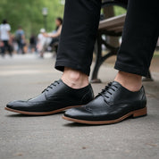 model-sitting-bench - Men's Full Grain Leather Wingtip Dress Shoes