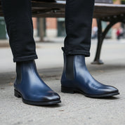 Men's Navy Blue Leather Ankle Chelsea Boots - model-sitting-bench