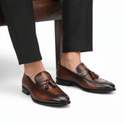 model-sitting-bench - Men's Shaded Tan Leather Tassel Loafers