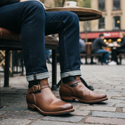 model-sitting-bench - Men's Tan & Black Two-Tone Leather Biker Boots