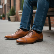 Men's Tan Leather Brogue Dress Shoes - model-sitting-bench