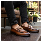 Men's Tan Leather Fringe Buckle Moccasins - model-sitting-bench