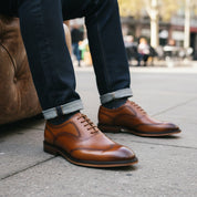 model-sitting-bench - Men's Tan Leather Oxford Dress Shoes