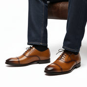 model-sitting-bench - Men's Tan Leather Wingtip Brogue Dress Shoes