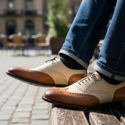 Men's Two-Tone Wingtip Brogue Leather Shoes - model-sitting-bench