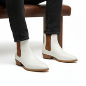 Men's White Chelsea Leather Boots - model-sitting-bench