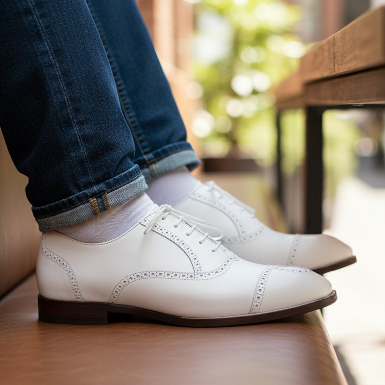 Men's White Wingtip Leather Party Shoes - model-sitting-bench