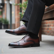 Men's Brown Leather Oxford Dress Shoes - model-sitting-bench
