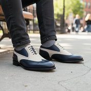 Two-Tone Wingtip Leather Dress Shoes - model-sitting-bench