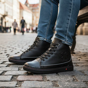 model-sitting-bench - Unisex Black Leather Biker Sneakers